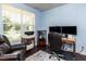 Bright home office with a large window and comfortable seating, perfect for remote work at 112 Victorian Oaks Dr, Durham, NC 27713