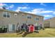 Backyard showcasing a lawn and patio, perfect for outdoor living in a townhome setting at 114 Montview Way, Knightdale, NC 27545