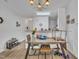 Dining area features modern table, open to kitchen, and natural light at 114 Montview Way, Knightdale, NC 27545