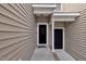Home entrance showcasing units 112 and 114, with neutral siding and covered front porch at 114 Montview Way, Knightdale, NC 27545