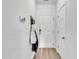 Hallway with coat rack, decor, neutral paint, and access to the main level at 114 Montview Way, Knightdale, NC 27545
