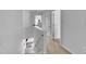 Upstairs hallway with white walls, carpeted floor, and access to bedrooms at 114 Montview Way, Knightdale, NC 27545