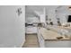 Kitchen featuring white cabinetry, laminate countertops, appliances, and hardwood flooring at 114 Montview Way, Knightdale, NC 27545