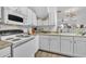 Bright kitchen features white cabinets, laminate countertops, and modern appliances at 114 Montview Way, Knightdale, NC 27545