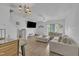 Spacious living room with modern decor, neutral paint, stylish furniture, and natural light at 114 Montview Way, Knightdale, NC 27545