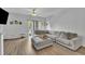 Bright living room with neutral color scheme, wooden floors, and sliding glass door at 114 Montview Way, Knightdale, NC 27545