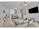 Open living space with comfy seating area, hardwood floors, and adjacent dining area at 114 Montview Way, Knightdale, NC 27545