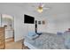 Main bedroom with a wall-mounted television, closet, and door to an on-suite bathroom at 114 Montview Way, Knightdale, NC 27545