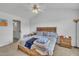 This main bedroom has a ceiling fan, bedside tables, and a window with natural light at 114 Montview Way, Knightdale, NC 27545