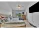 Main bedroom features a ceiling fan, natural light, and large bed at 114 Montview Way, Knightdale, NC 27545