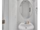 Modern half bathroom featuring a round mirror, vanity, and neutral paint at 114 Montview Way, Knightdale, NC 27545