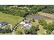 Overhead shot of property features a pond, greenery, and surrounding landscape at 1199 Cesar Ct, Graham, NC 27253