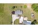 Aerial view of the property, highlighting the house, pool, and surrounding landscape at 1199 Cesar Ct, Graham, NC 27253