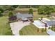 Overhead view highlighting a house, pond and a private pool, complemented by lush greenery and serene surroundings at 1199 Cesar Ct, Graham, NC 27253