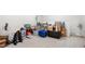 Unfinished basement with carpet, boxes, weights, and desk offering potential for customization and extra space at 1199 Cesar Ct, Graham, NC 27253