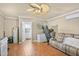 Bonus room with ceiling fan, couch, and kitchenette, blending comfort and utility at 1199 Cesar Ct, Graham, NC 27253