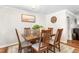 Comfortable dining room with a wooden table, seating for six, and neutral decor at 1199 Cesar Ct, Graham, NC 27253