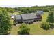 Attractive exterior shot of the brick house with a well-maintained lawn and lush landscaping at 1199 Cesar Ct, Graham, NC 27253