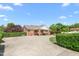 Charming brick home with a spacious front yard, covered porch, and well-manicured landscaping creating curb appeal at 1199 Cesar Ct, Graham, NC 27253