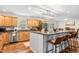 Bright kitchen featuring an island with seating, granite countertops, and stainless steel appliances at 1199 Cesar Ct, Graham, NC 27253