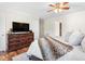 Comfortable main bedroom with hardwood floors, ceiling fan and an ensuite bathroom at 1199 Cesar Ct, Graham, NC 27253