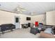 Relaxing outdoor patio area with comfortable seating, ceiling fans, and grill at 1199 Cesar Ct, Graham, NC 27253