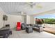 Relaxing outdoor patio with ceiling fans, comfortable seating and a view at 1199 Cesar Ct, Graham, NC 27253