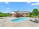 Inviting pool area with lounge chairs, set against a brick home with lush landscaping at 1199 Cesar Ct, Graham, NC 27253