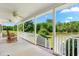 Spacious covered porch with rocking chairs and a view of the pond at 1199 Cesar Ct, Graham, NC 27253