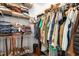 Walk-in closet with built-in shelving, rods and hardwood floors providing efficient storage at 1199 Cesar Ct, Graham, NC 27253