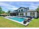 Beautiful backyard showcasing a modern pool, comfortable seating, and well-maintained landscaping for relaxation at 1209 Briar Patch Ln, Raleigh, NC 27615