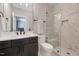 Modern bathroom featuring a marble tiled shower with a built-in bench and glass enclosure at 1209 Briar Patch Ln, Raleigh, NC 27615