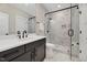 Modern bathroom with glass-enclosed shower, sleek vanity, and stylish fixtures at 1209 Briar Patch Ln, Raleigh, NC 27615