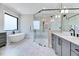 Beautiful bathroom featuring a glass-enclosed shower, soaking tub, and modern fixtures at 1209 Briar Patch Ln, Raleigh, NC 27615