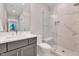 Sleek bathroom featuring a glass-enclosed shower with marble tile and a modern vanity at 1209 Briar Patch Ln, Raleigh, NC 27615