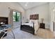 Bedroom featuring a comfortable bed, neutral walls, and abundant natural light from a large window at 1209 Briar Patch Ln, Raleigh, NC 27615