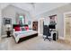 Inviting bedroom with bed, side table, and a view into the bathroom at 1209 Briar Patch Ln, Raleigh, NC 27615