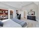 Bedroom with a large bed, an office nook, and a closet at 1209 Briar Patch Ln, Raleigh, NC 27615