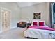 Bedroom featuring neutral carpet, a comfortable bed, natural light, and seating at 1209 Briar Patch Ln, Raleigh, NC 27615