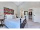 A comfortable bedroom boasting a decorative painting and an accessible walk-in closet at 1209 Briar Patch Ln, Raleigh, NC 27615