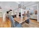 Open-concept kitchen and dining area with a large island and modern appliances at 1209 Briar Patch Ln, Raleigh, NC 27615