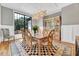 Elegant dining room with stylish chandelier, a checkered rug and large view to the yard at 1209 Briar Patch Ln, Raleigh, NC 27615
