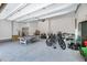 Well-organized garage with epoxy floors, ping pong table, bike rack, and ample space for storage and activities at 1209 Briar Patch Ln, Raleigh, NC 27615