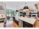Kitchen island with a farmhouse sink, stainless steel dishwasher, and counter seating at 1209 Briar Patch Ln, Raleigh, NC 27615