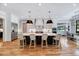 Bright, open kitchen with a large center island, pendant lights, and stainless steel appliances at 1209 Briar Patch Ln, Raleigh, NC 27615