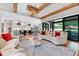 Open-concept living area with natural light, stylish furnishings, and view to kitchen at 1209 Briar Patch Ln, Raleigh, NC 27615