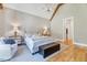 Bedroom featuring vaulted ceiling, wood beam, neutral decor, and ample natural light at 1209 Briar Patch Ln, Raleigh, NC 27615