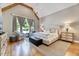 Bedroom features a vaulted ceiling, wood beam, large windows, and comfortable seating at 1209 Briar Patch Ln, Raleigh, NC 27615