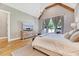 Bright bedroom showcasing a vaulted ceiling, wood beam, and large windows at 1209 Briar Patch Ln, Raleigh, NC 27615