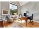Elegant home office featuring a large window, hardwood floors, and sophisticated decor at 1209 Briar Patch Ln, Raleigh, NC 27615